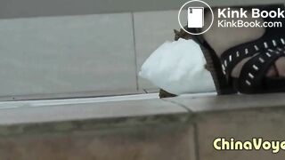 Girl in green dress pooping