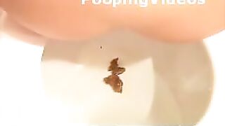 Two girls pooping on the toilet