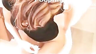 Two girls pooping on the toilet