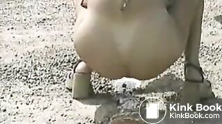 Girl pooping on the road