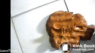 Kinky Asian chick bends over and squeezes out a big brown turd
