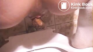 woman pooping in toilet - video 2