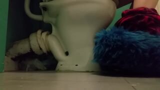 Girl with fluffy slippers pooping on the toilet