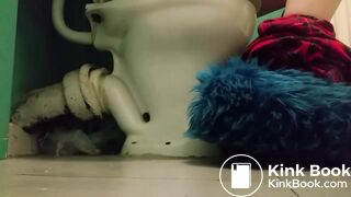 Girl with fluffy slippers pooping on the toilet