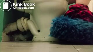 Girl with fluffy slippers pooping on the toilet