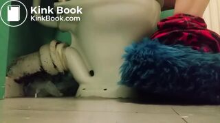 Girl with fluffy slippers pooping on the toilet