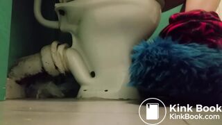 Girl with fluffy slippers pooping on the toilet