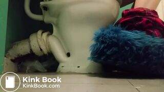 Girl with fluffy slippers pooping on the toilet