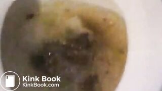 Young girl pooping in toilet.