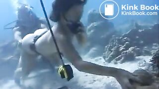 Two girls pooping underwater