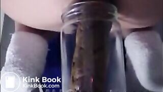 Woman pooping into jar.1