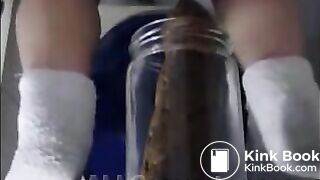 Woman pooping into jar.1