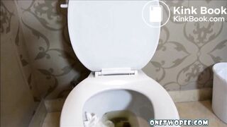 sexy woman pooping on toilet.