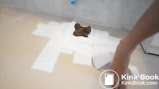 Brunette girl is pooping in the bathroom