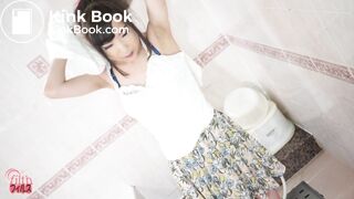 Shy Japanese girl unloading in the bathtub