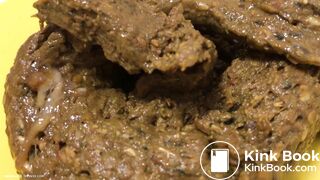 A blonde girl shit then scrutinized it.