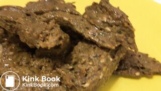 A blonde girl shit then scrutinized it.