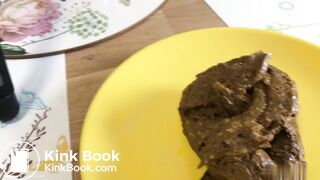 A blonde girl shit then scrutinized it.