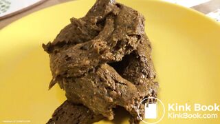 A blonde girl shit then scrutinized it.