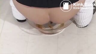 Two girls feeding a guy in the toilet