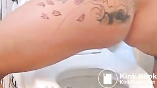 Young girl pooping in toilet