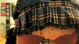 Girl fills her diaper under skirt