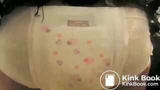 Girl fills her diaper under skirt