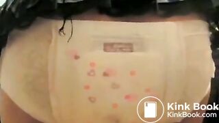 Girl fills her diaper under skirt