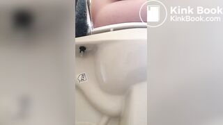 Girl pees and poops on toilet