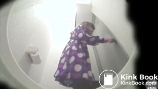 jap girls poop over the toilet