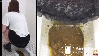 2 Japanese girls diarrhea in floor toilet.