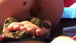 Black turds on her teenie feet
