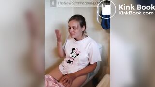 Girl pooping and straining on toilet