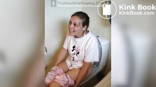 Girl pooping and straining on toilet