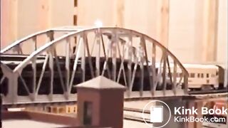 Girl shitting on a model train