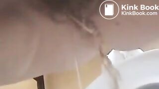 Milf pooping over toilet