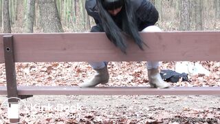 Anni pooping on a bench