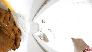 Japanese shitting on toilet.