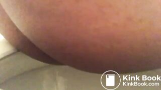 Close up ebony on toilet.