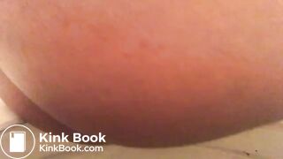 Close up ebony on toilet.