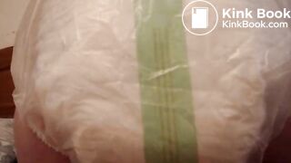 Mature woman pooping and peeing in her large diaper