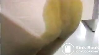 Asian woman poops her skirt.