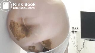 Girl is shitting a huge dump in tight pants