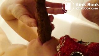 Sucking cock while being smeared in shit