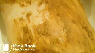 Sucking cock while being smeared in shit