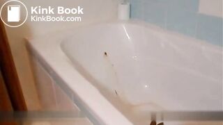 Blonde shitting and pissing inside the bathtub