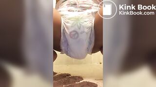 Ebony chick messes diaper