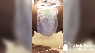 Ebony chick messes diaper