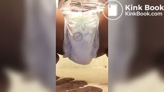 Ebony chick messes diaper