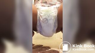 Ebony chick messes diaper